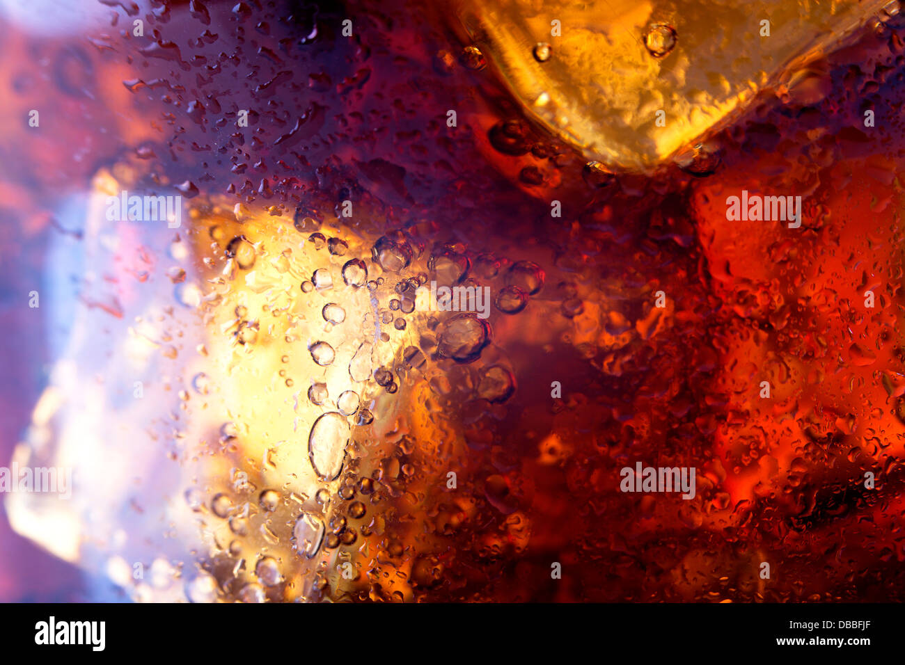 Close up view of the ice cubes in cola background Stock Photo - Alamy