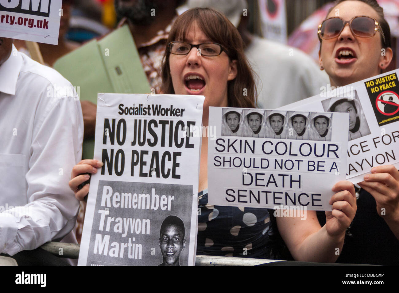 London, UK. 27th July, 2013. A woman chants slogans on the march from the US embassy to Downing street demanding Justice for Trayvon Martin, a black American teenager shot dead. His killer, George Zimmerman, was acquitted. Credit:  Paul Davey/Alamy Live News Stock Photo