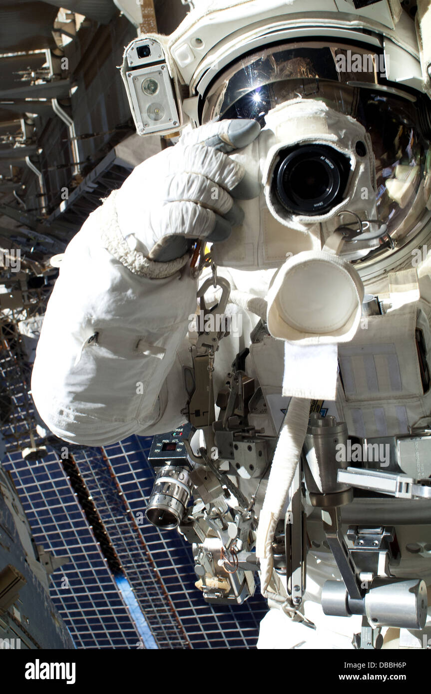 Astronaut takes a self portrait on a spacewalk Stock Photo