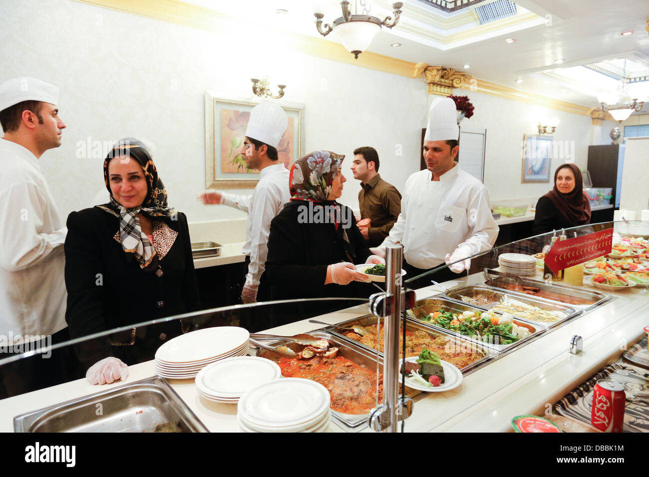 cook and servers at Hani self service restaurant, Tehran, Iran Stock Photo