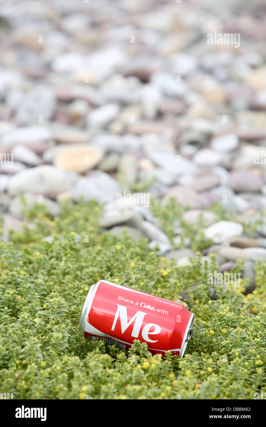 Coke can on beach Stock Photo