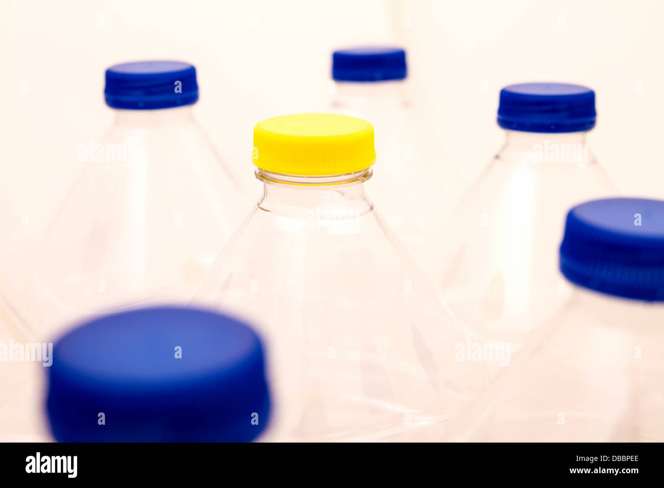 Empty bottles of mineral water, one with a different lid Stock Photo Alamy