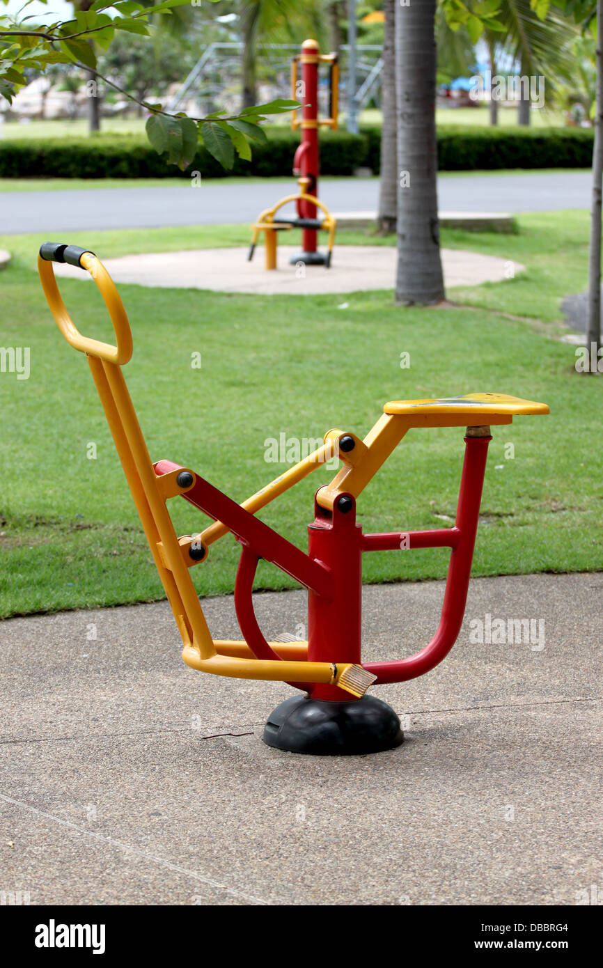 Red and yellow Exercise equipment in the park. Stock Photo