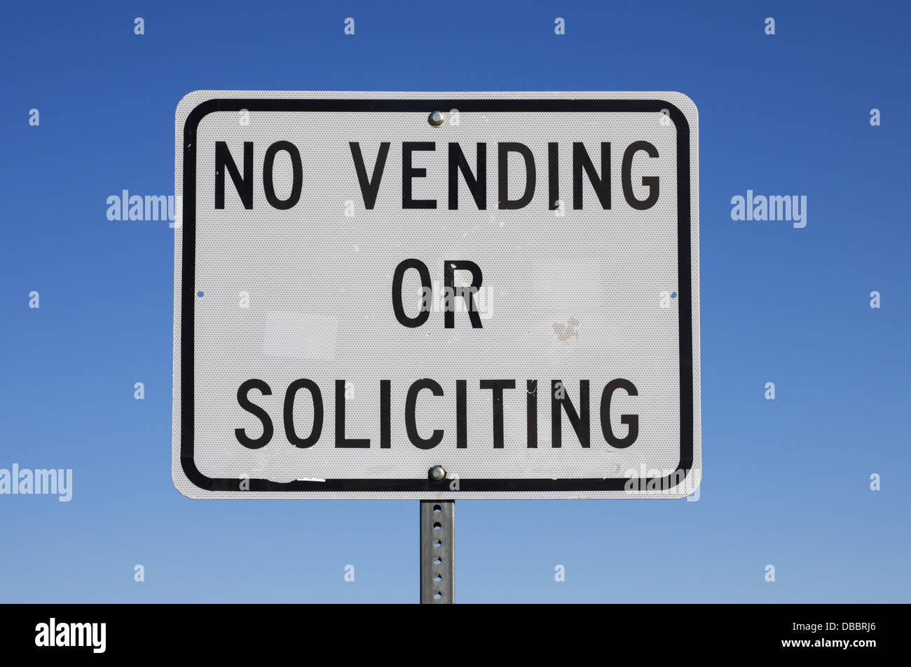 no vending or soliciting sign with blue sky background Stock Photo