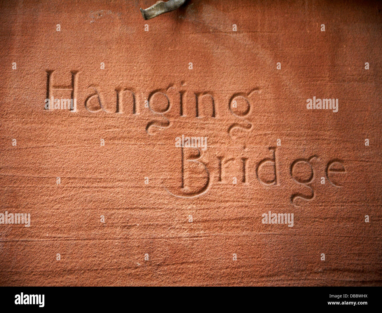 Hanging Bridge street name carved in sandstone Manchester UK Stock Photo