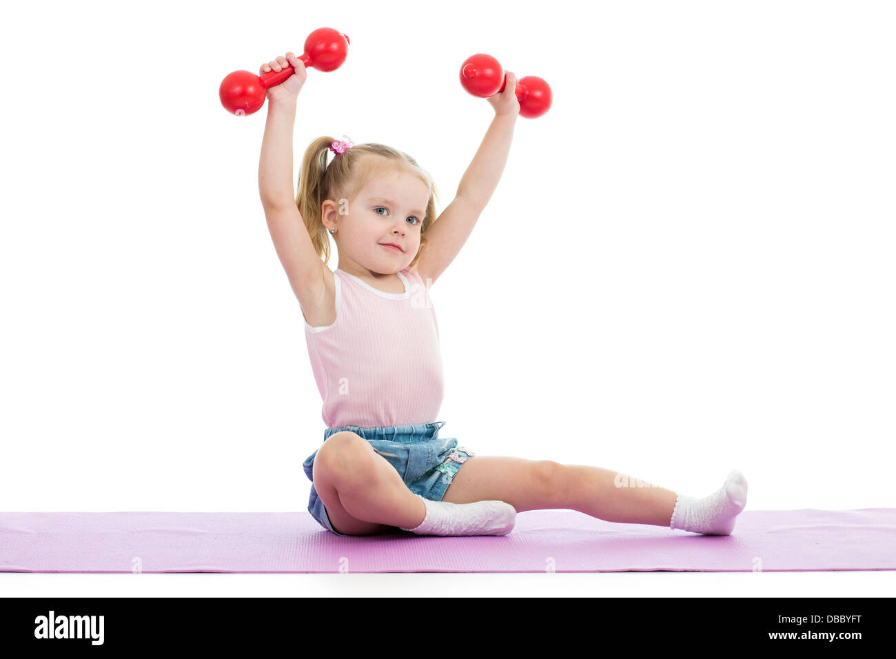 Kid doing exercises with dumbbells Stock Photo - Alamy