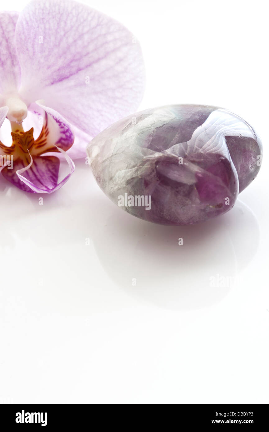 Orchid and purple quartz . Stock Photo