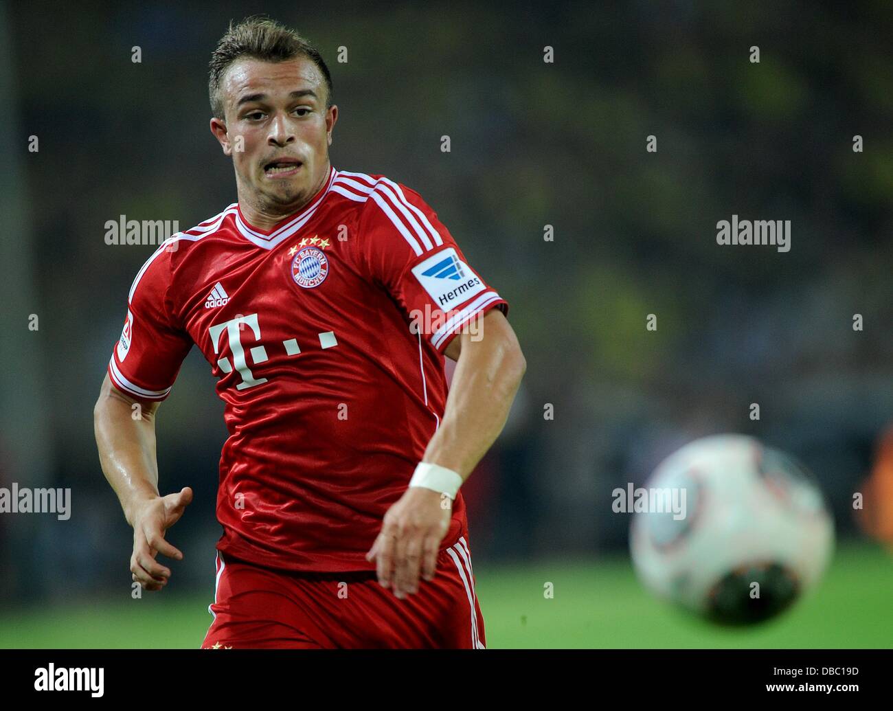 Dortmund, Germany. 27th July, 2013. Munich's Xherdan Shaqiri is ...