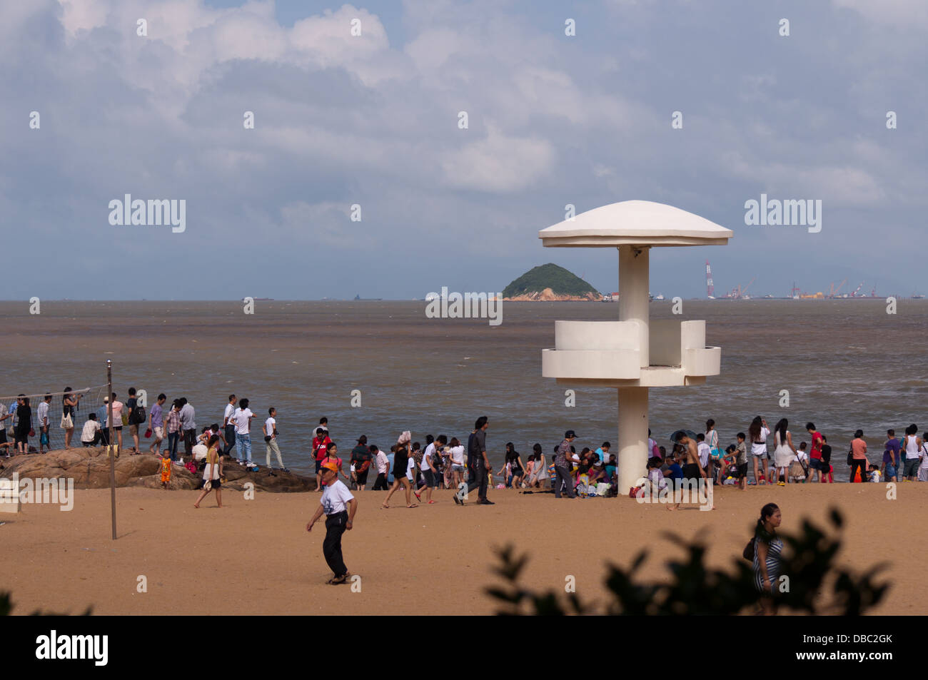Crowd people at hot summer swimming at the beach in Zhuhai, China Stock Photo