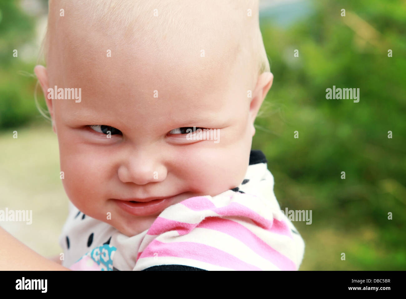 Funny smiling baby girl outdoor summer closeup portrait Stock Photo Alamy