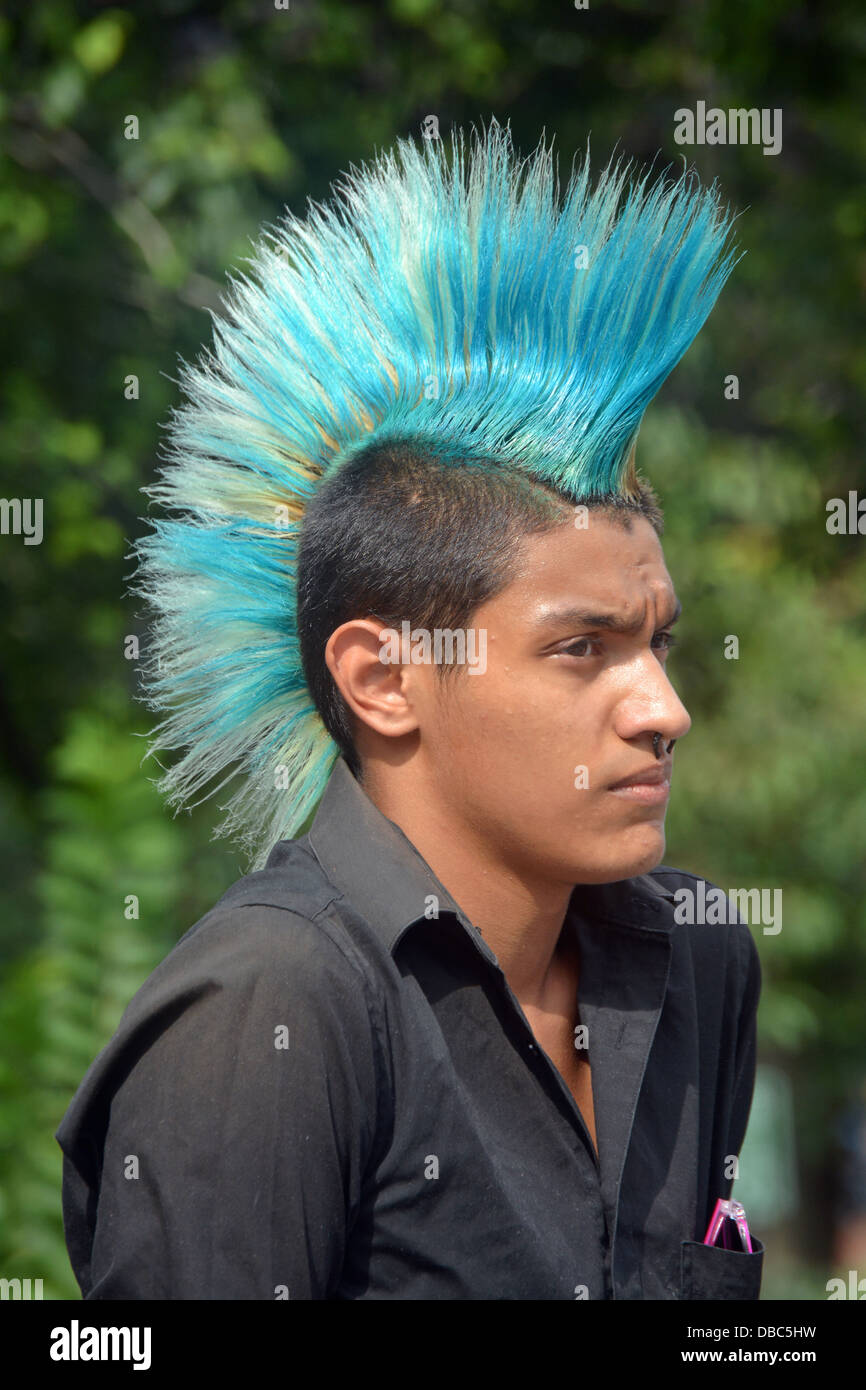 Portrait of a young man with a colorful Mohawk haircut at Union Square Park  in New York City Stock Photo - Alamy