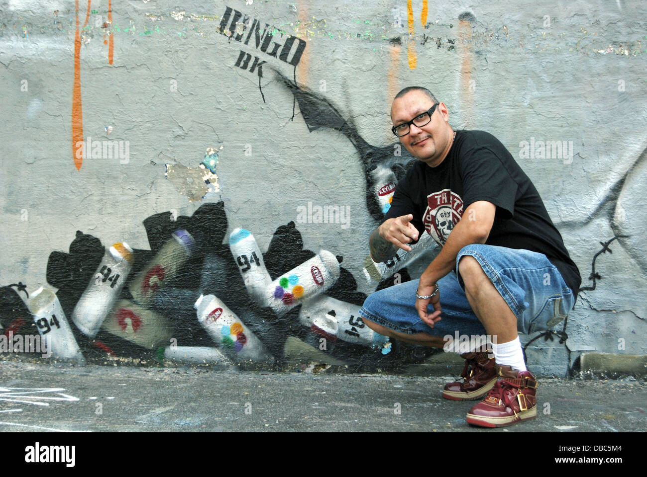 Portrait of world famous graffiti artist in front of his work at 5
