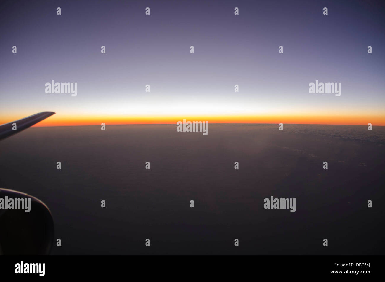 Veiw of sunset from airplane window Stock Photo