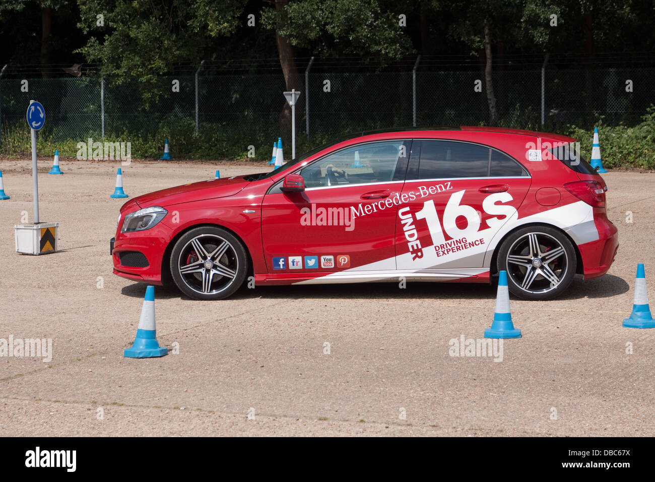A young driver taking part in an under 16s driving experience at Mercedes-Benz world UK, Weybridge, Surrey Stock Photo