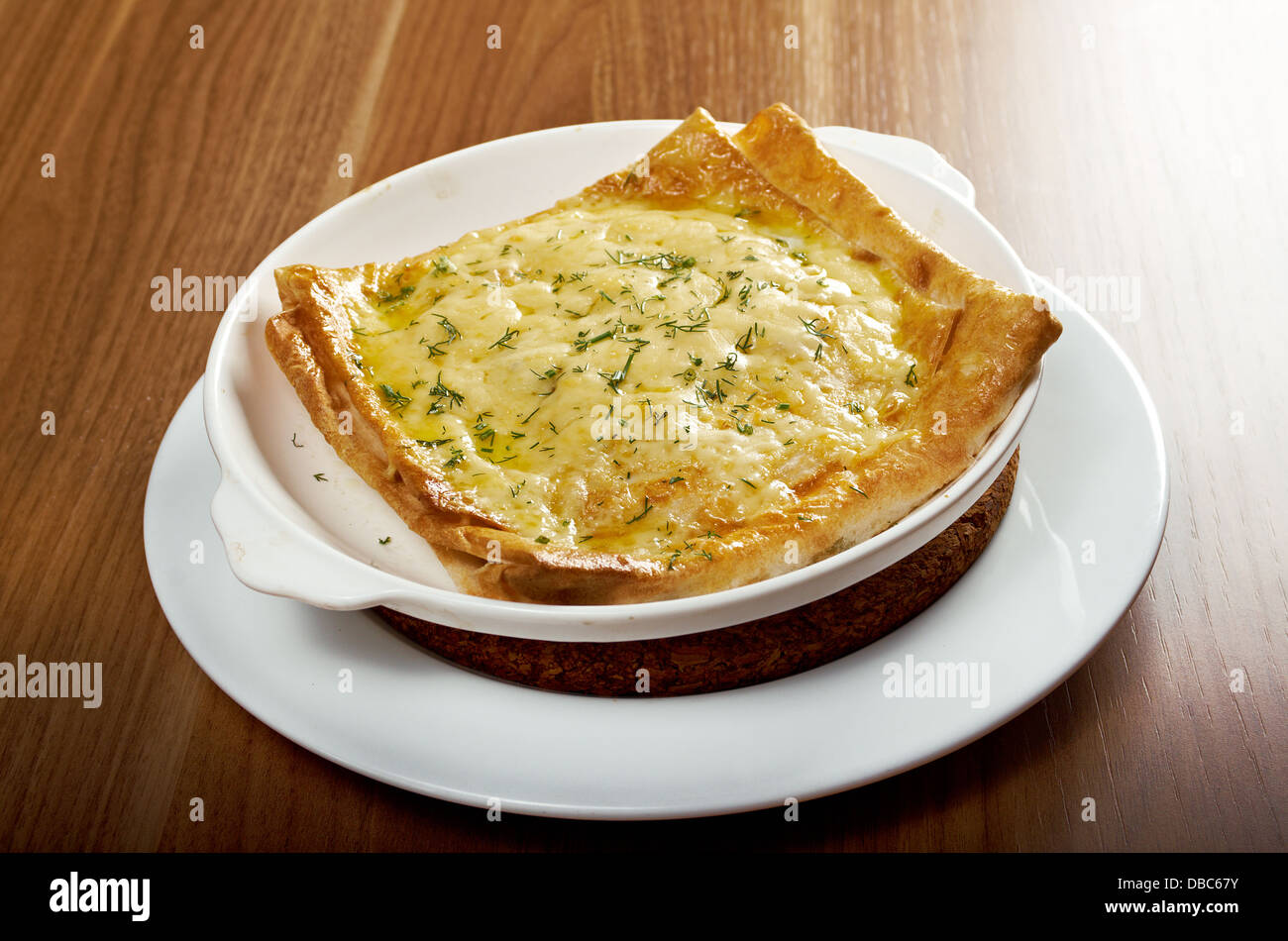 Qutab - baked lavash cheese pie .georgian bread and cheese suluguni  Stock Photo