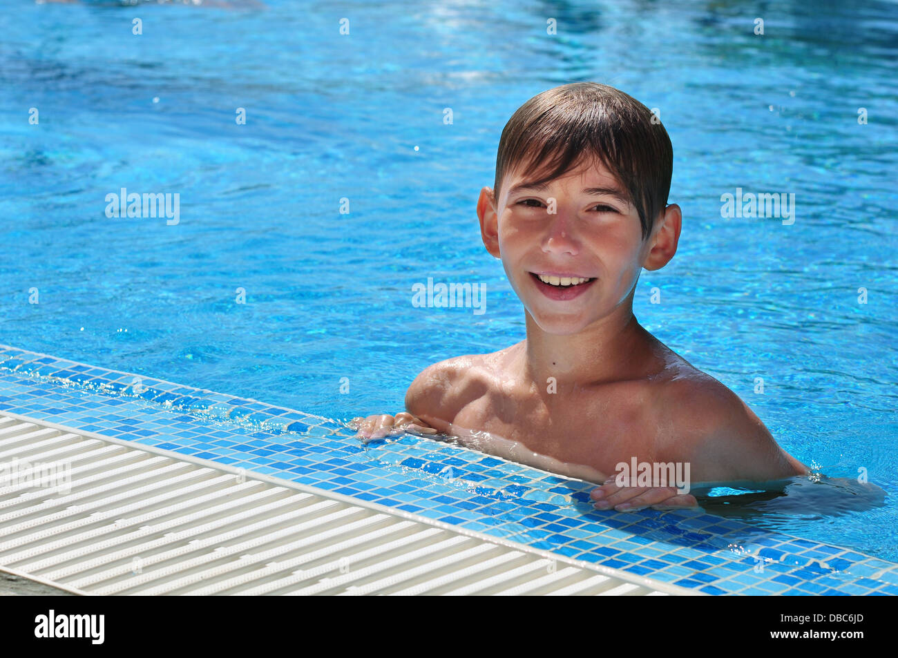 happy boy in outdoor swimming pool in sunny day Stock Photo Alamy