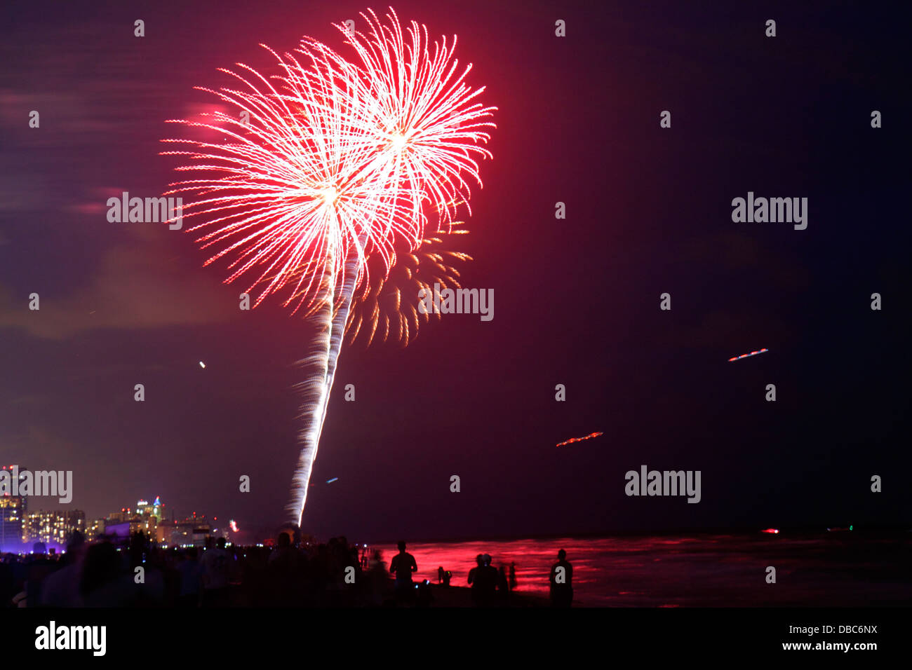 Miami Beach Florida,Fourth 4th of July,fireworks product products display sale,celebration,public event,burst,night,Atlantic Ocean water,shoreline,cro Stock Photo