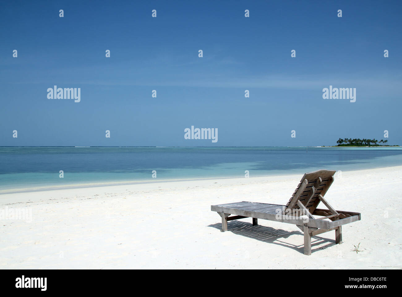 Deckchair on the White Sand Beach of Bodufinolhu (Fun Island), South Male Atoll, Maldives Stock Photo