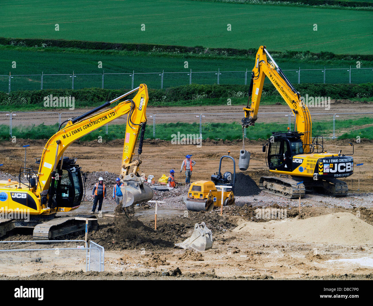 Diggers preparing land for house building, Grantham, Lincs, England Stock Photo