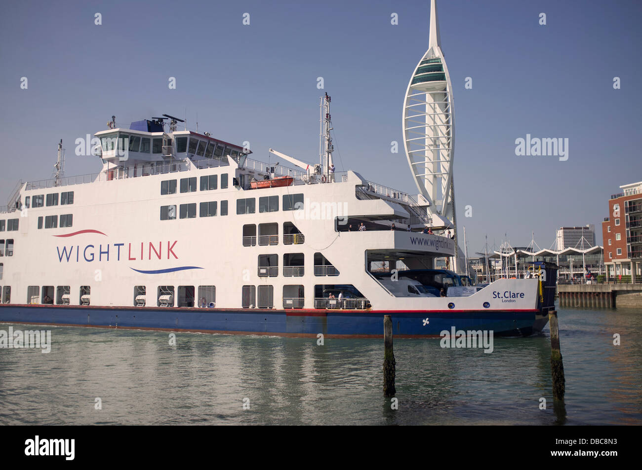 Wight Link ferry entering Portsmouth Harbour with the Spinnaker Tower in the background Stock Photo
