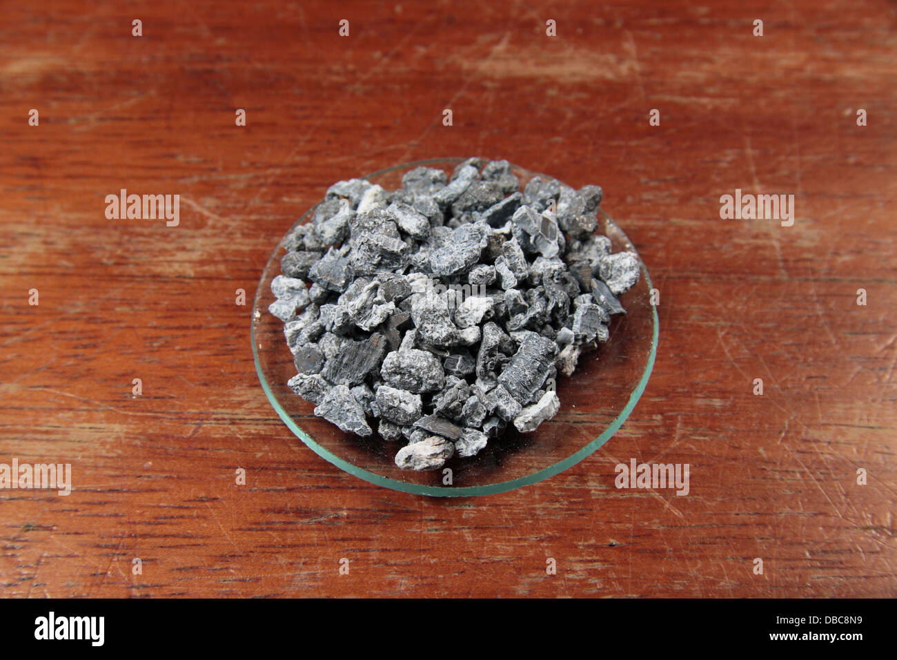 Granules of the metal calcium (Ca) as used in a UK high school. Stock Photo
