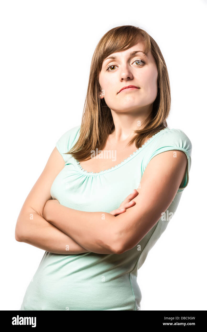 Standing young pretty woman with arrogant face, isolated on white background Stock Photo