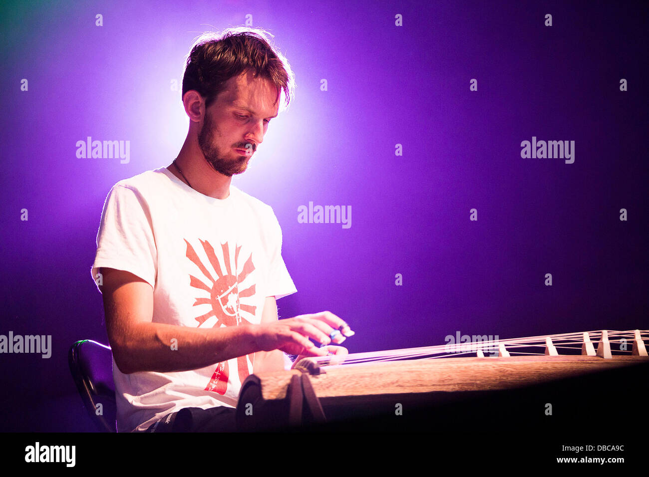 Malmesbury, UK. 28th July, 2013. Jonah Brody plays the Japanese Koto during Mercury Prize nominated Sam Lee's performance at WOMAD festival in Charlton Park near Malmesbury in Wiltshire. The world music festival attracts nearly 40,000 people to the rural location. Credit:  Adam Gasson/Alamy Live News Stock Photo