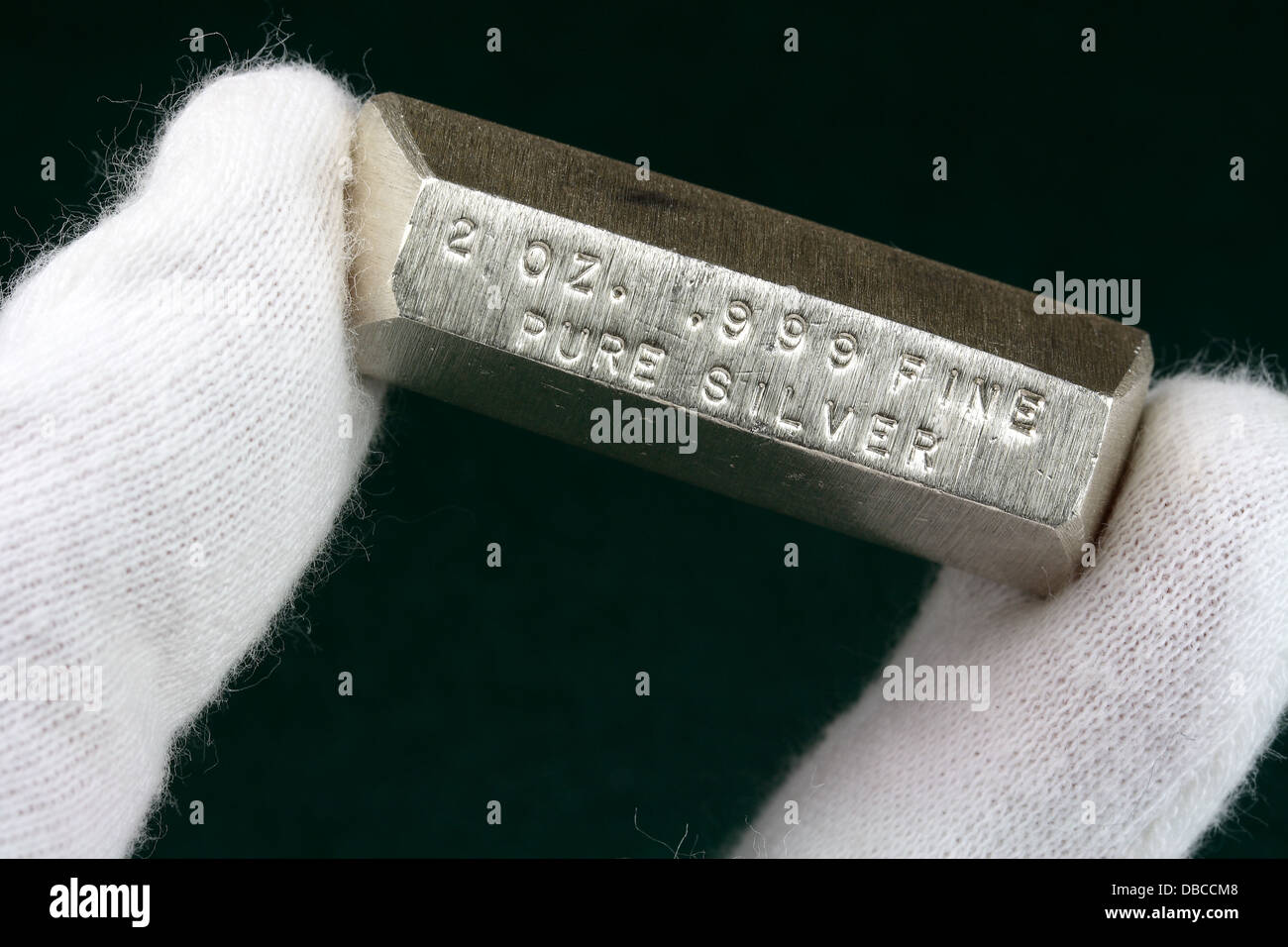 https://c8.alamy.com/comp/DBCCM8/2-troy-ounce-silver-bullion-bar-held-between-fingers-DBCCM8.jpg