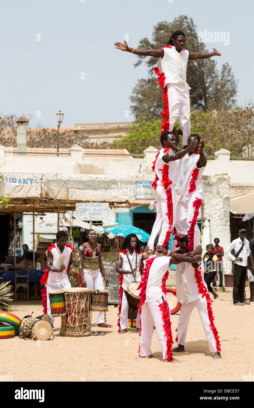 Gymnasts Perform to Welcome Visitors to Biannual Arts Festival, Goree Island, Senegal. Stock Photo
