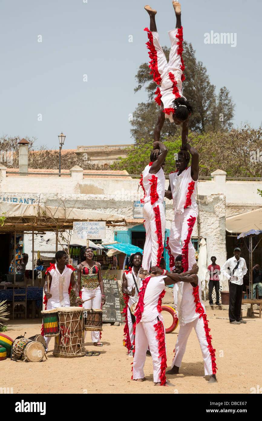 Gymnasts Perform to Welcome Visitors to Biannual Arts Festival, Goree Island, Senegal. Stock Photo