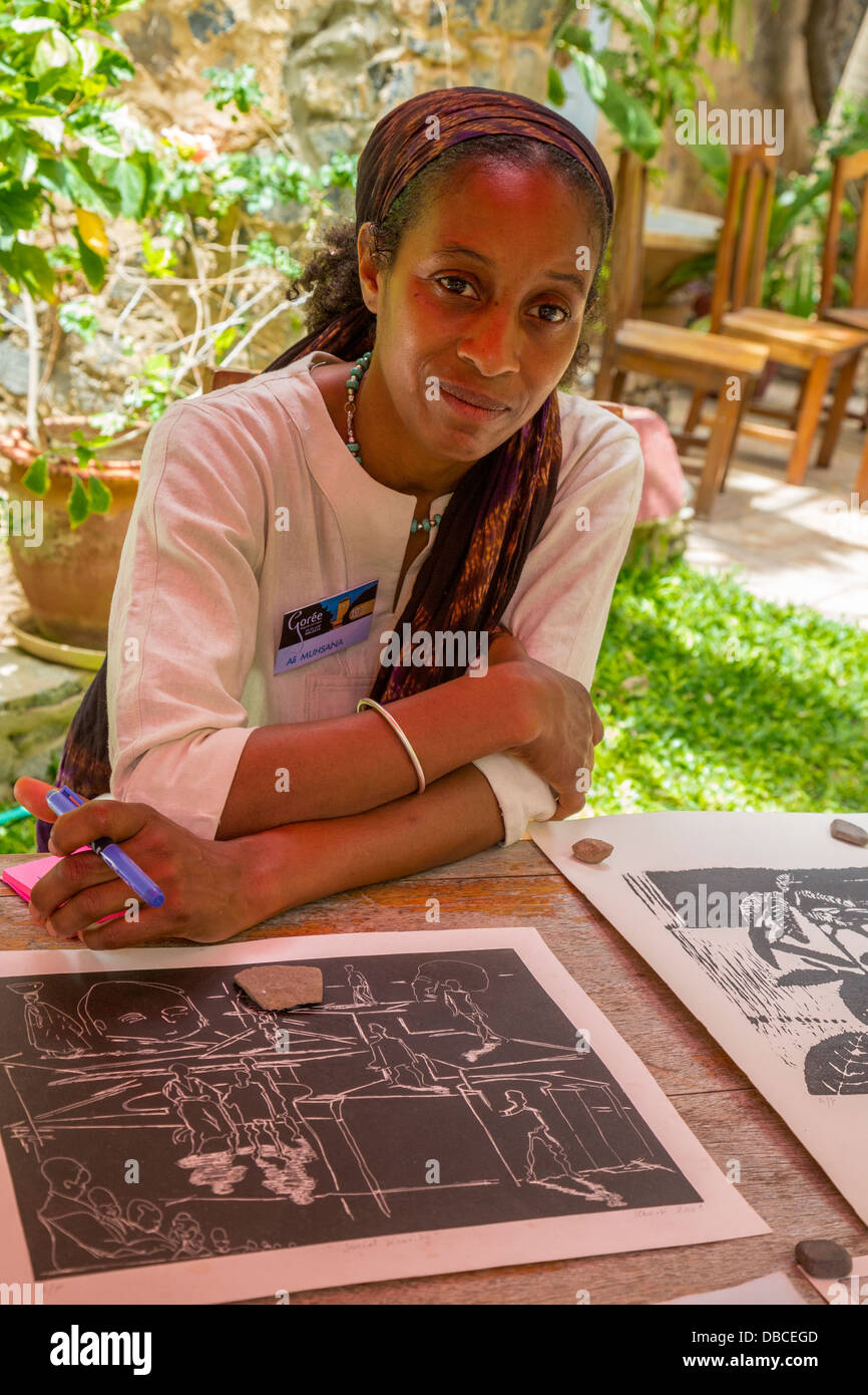 Artist Muhsana Ali with Work of Husband Amadou Kane Sy at Biannual Arts Festival, Goree Island, Senegal. Stock Photo