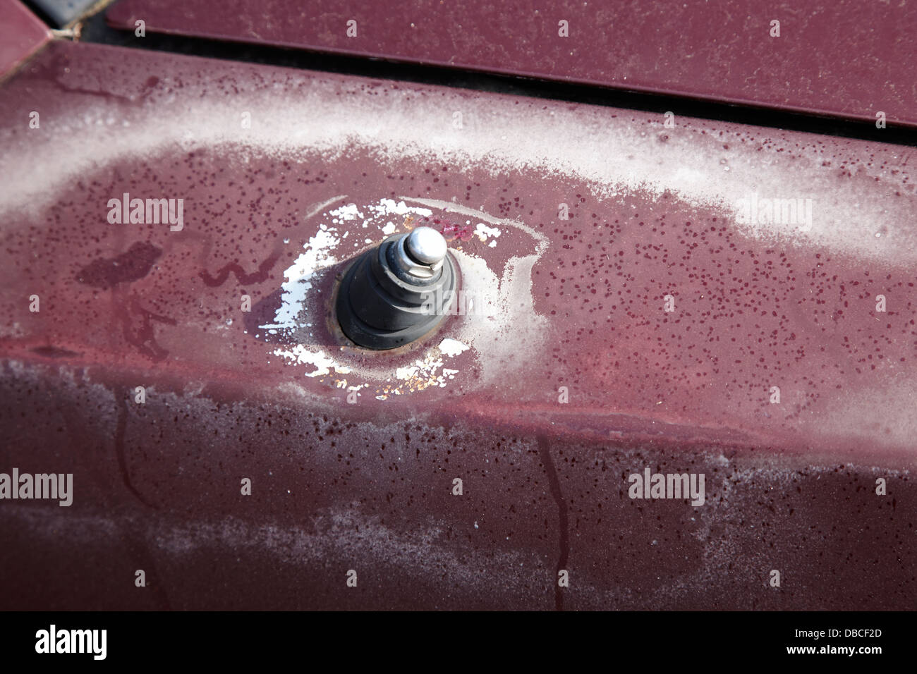 sun damaged car paintwork and corroded car aerial Stock Photo Alamy
