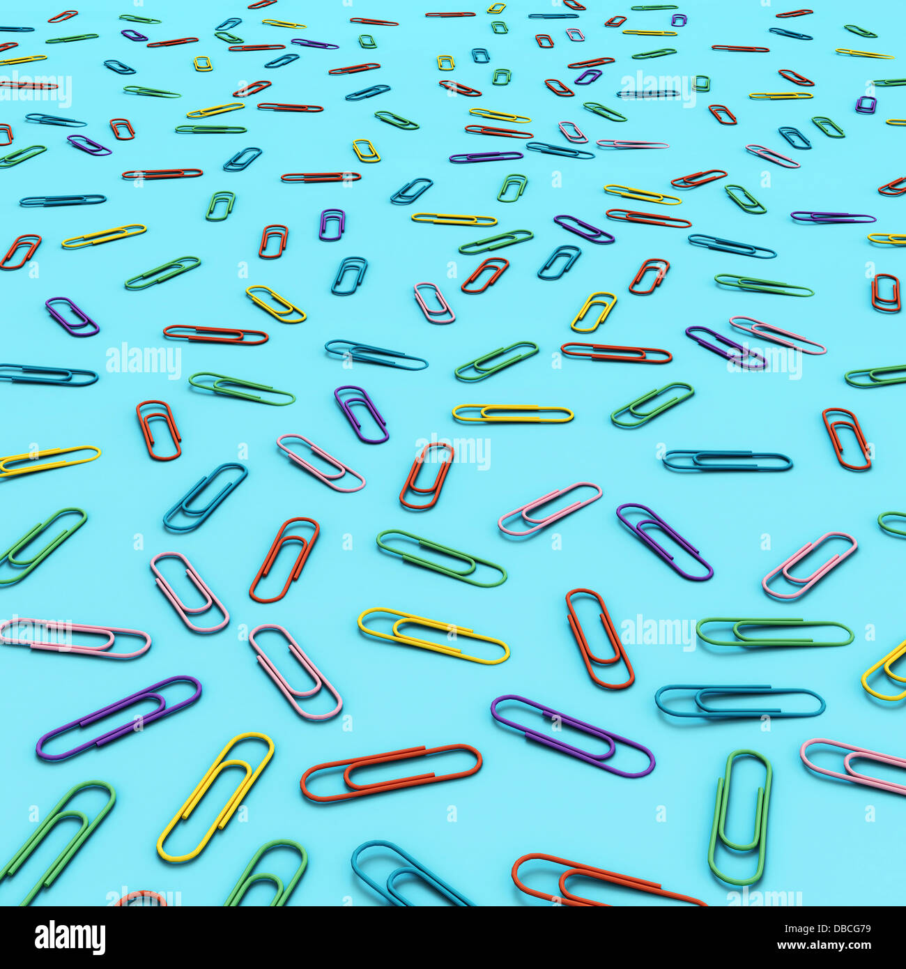 Illustration of various multi colored paper clips over blue background Stock Photo