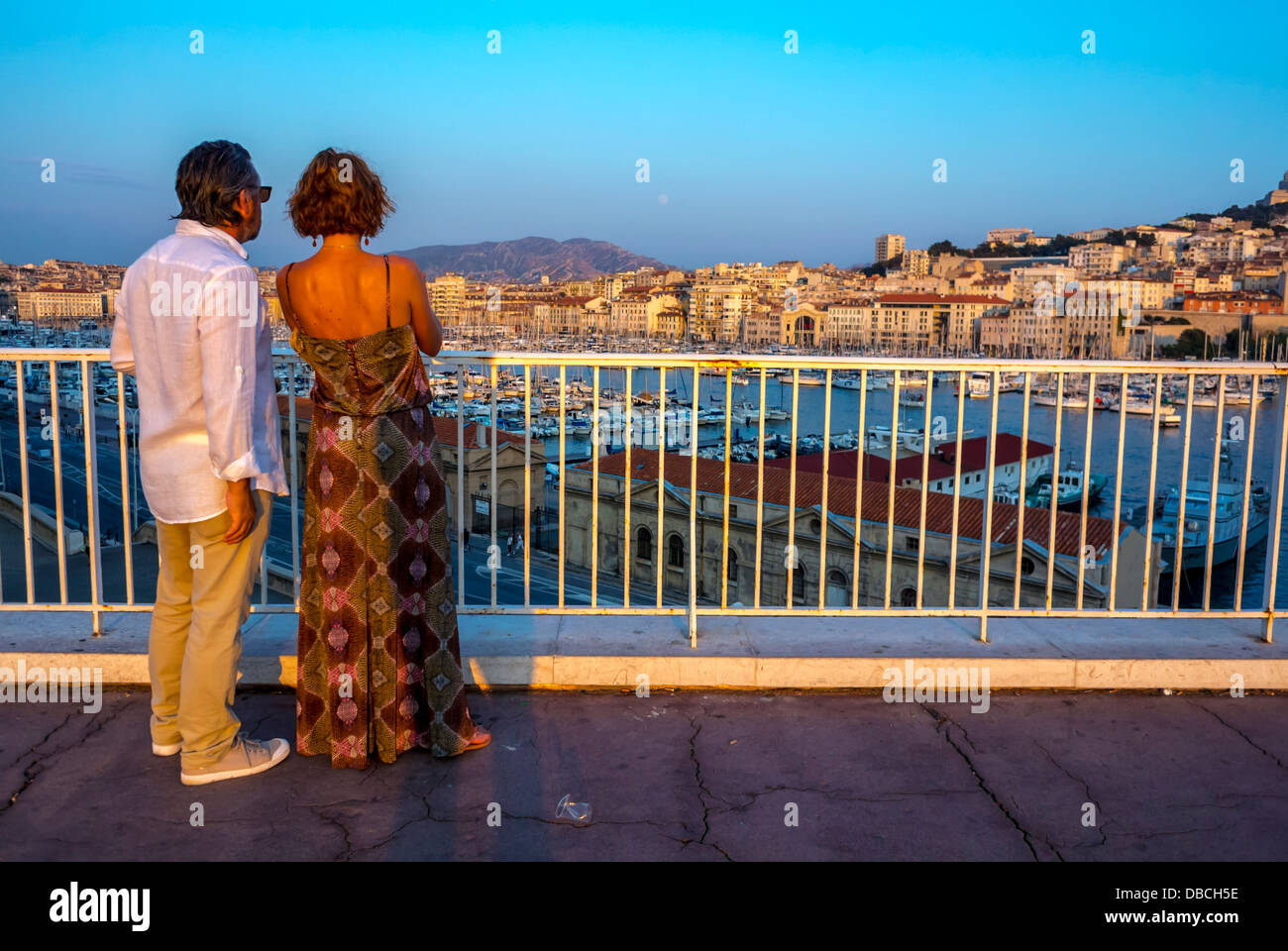 Marseille France, Tourist Couple, Rear, Visiting Romantic Cityscapes of 'Vieux Port' area, at Dusk, Old Port, Scenics, Woman Standing, Rear, Sunset Stock Photo