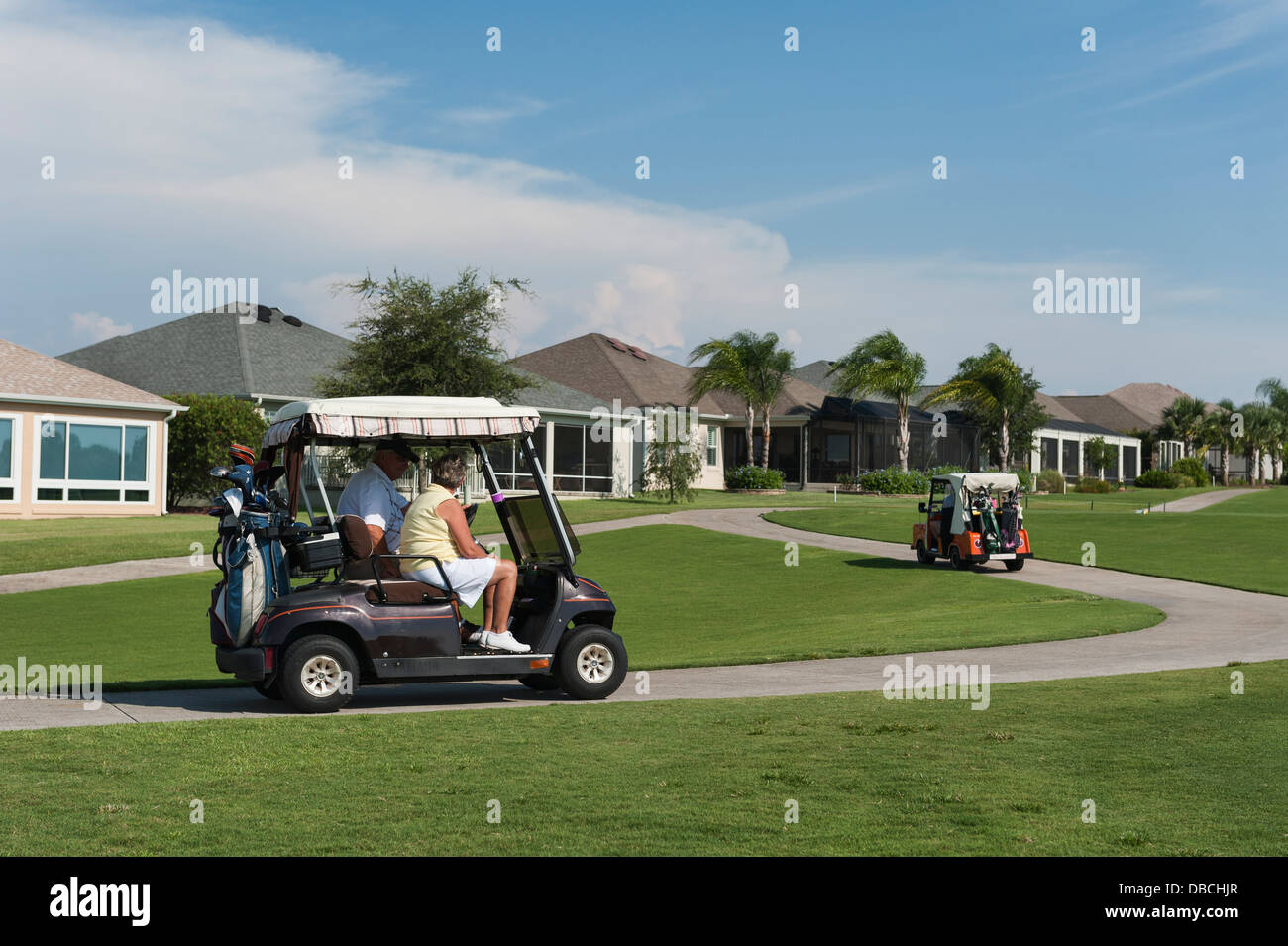 Golf Carts traveling on the grounds of the Mallory Hill Country Club in