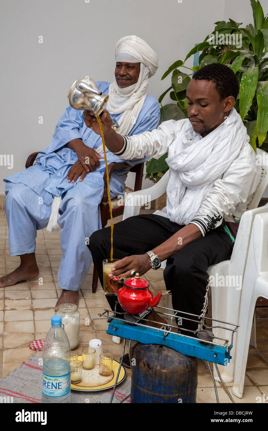 Nigerien Tuareg Pouring Tea, Biannual Arts Festival, Goree Island, Senegal. Father and Son. Stock Photo