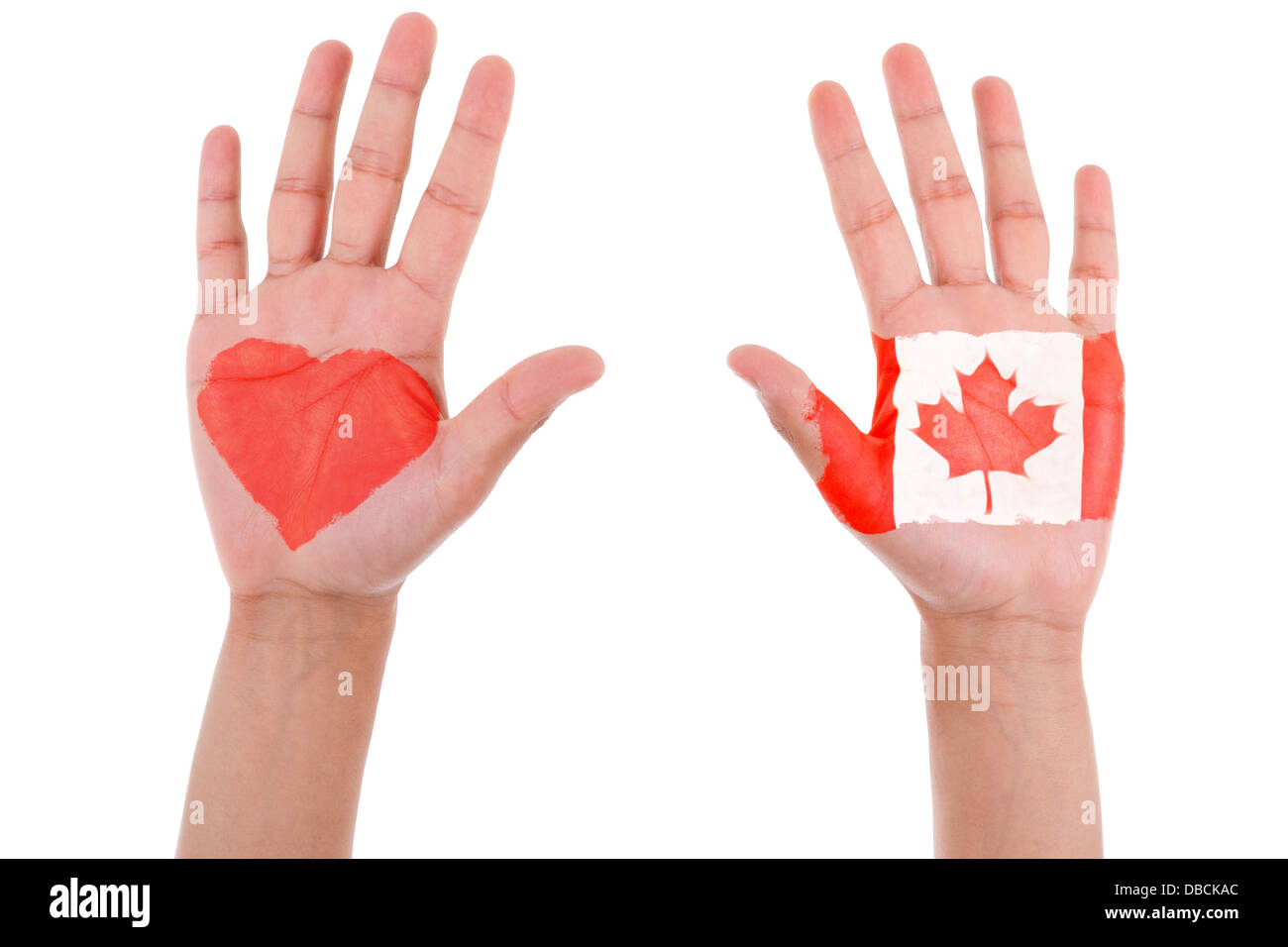 Hands with a painted heart and canadian flag, i love canada concept, isolated on white background Stock Photo