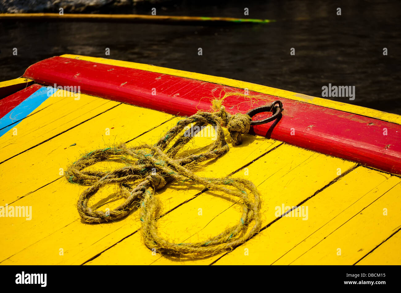 Closeup of a colorful boat and rope in Xochimilco canals in Mexico City ...