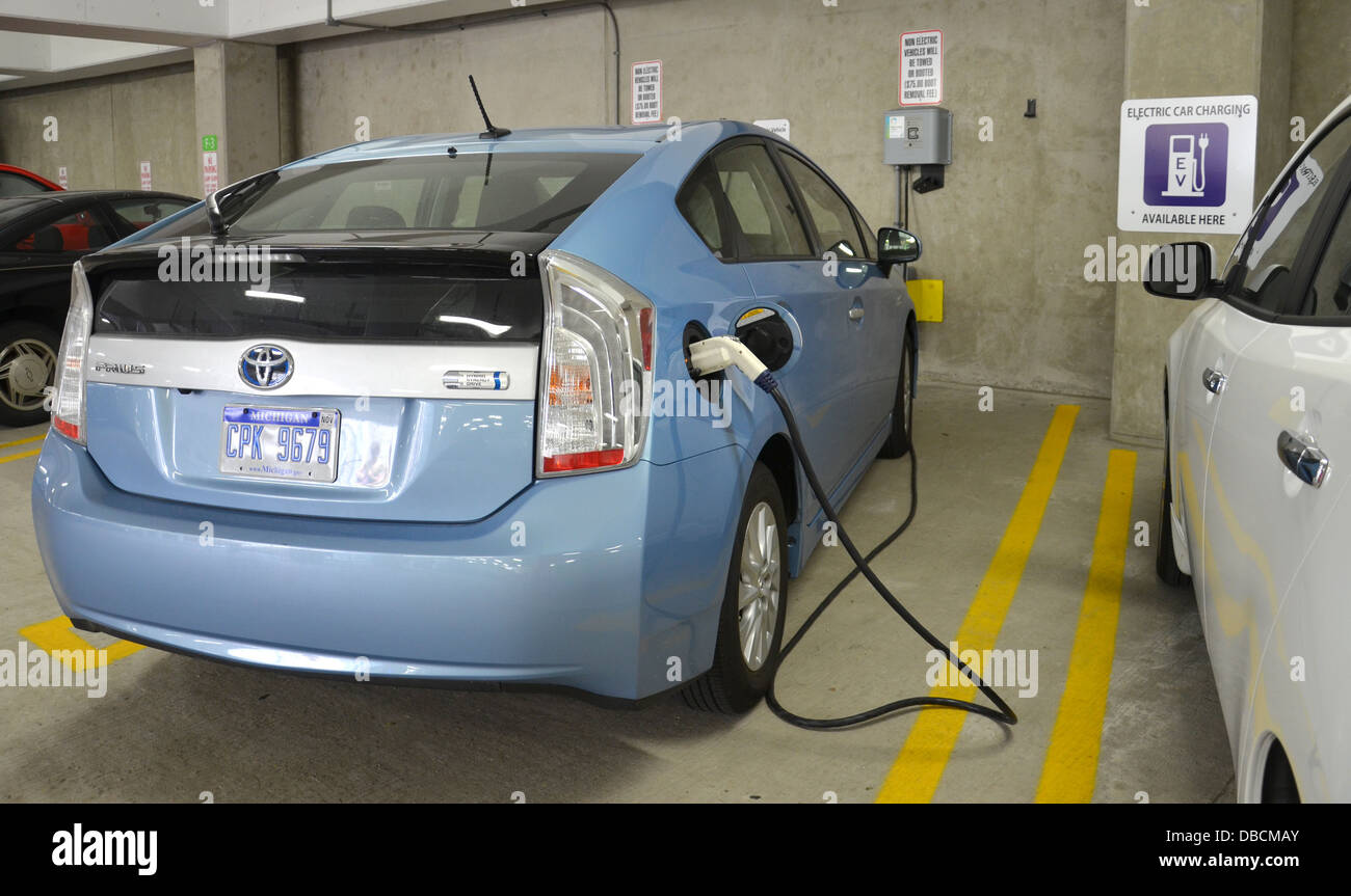 ANN ARBOR, MICHIGAN - JUNE 21: A car being charged at one of the 18 electric vehicle chargers in Ann Arbor on June 21, 2013. Stock Photo