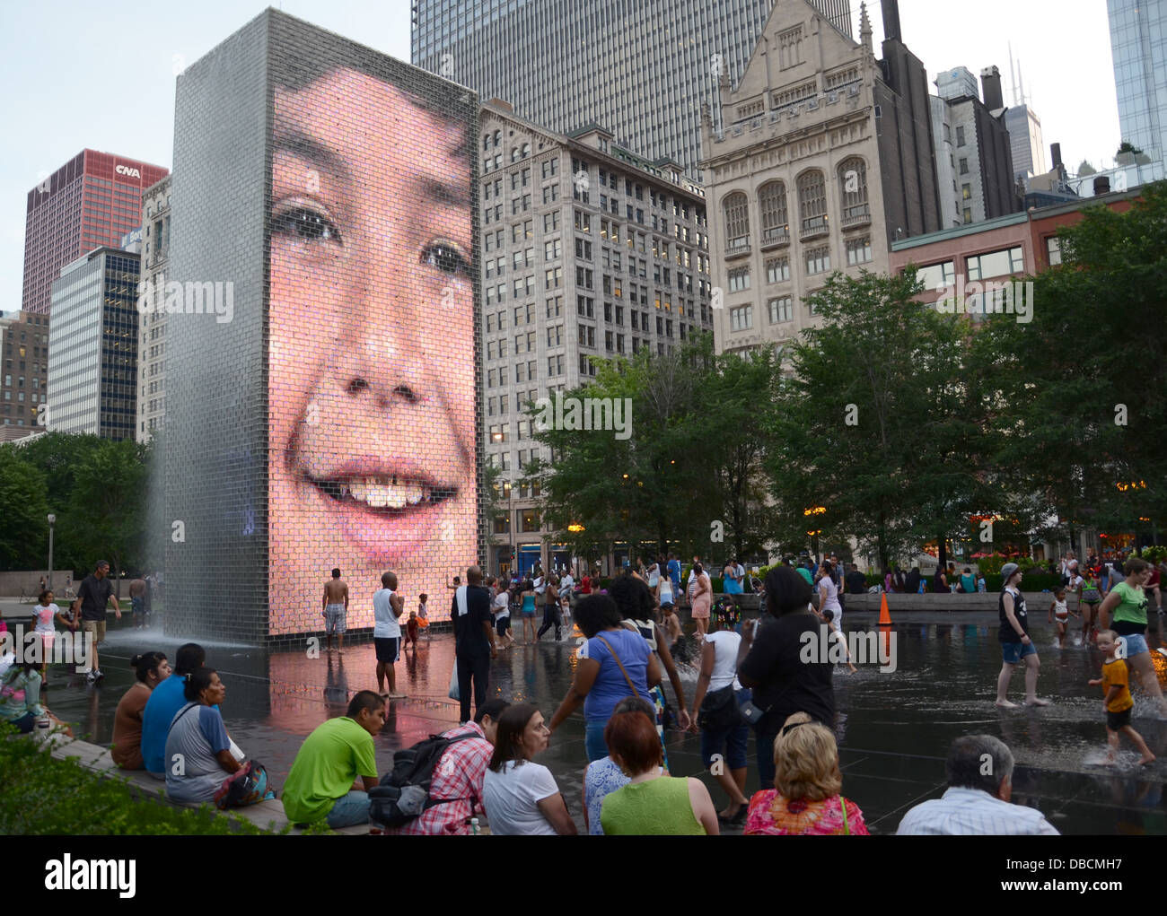 CHICAGO - JULY 18: People seek relief from the heat at Crown Fountain in downtown Chicago on July 18, 2013. Stock Photo