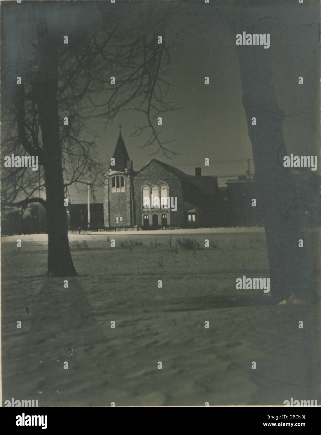 A historic photograph of a village church, capturing its architectural ...