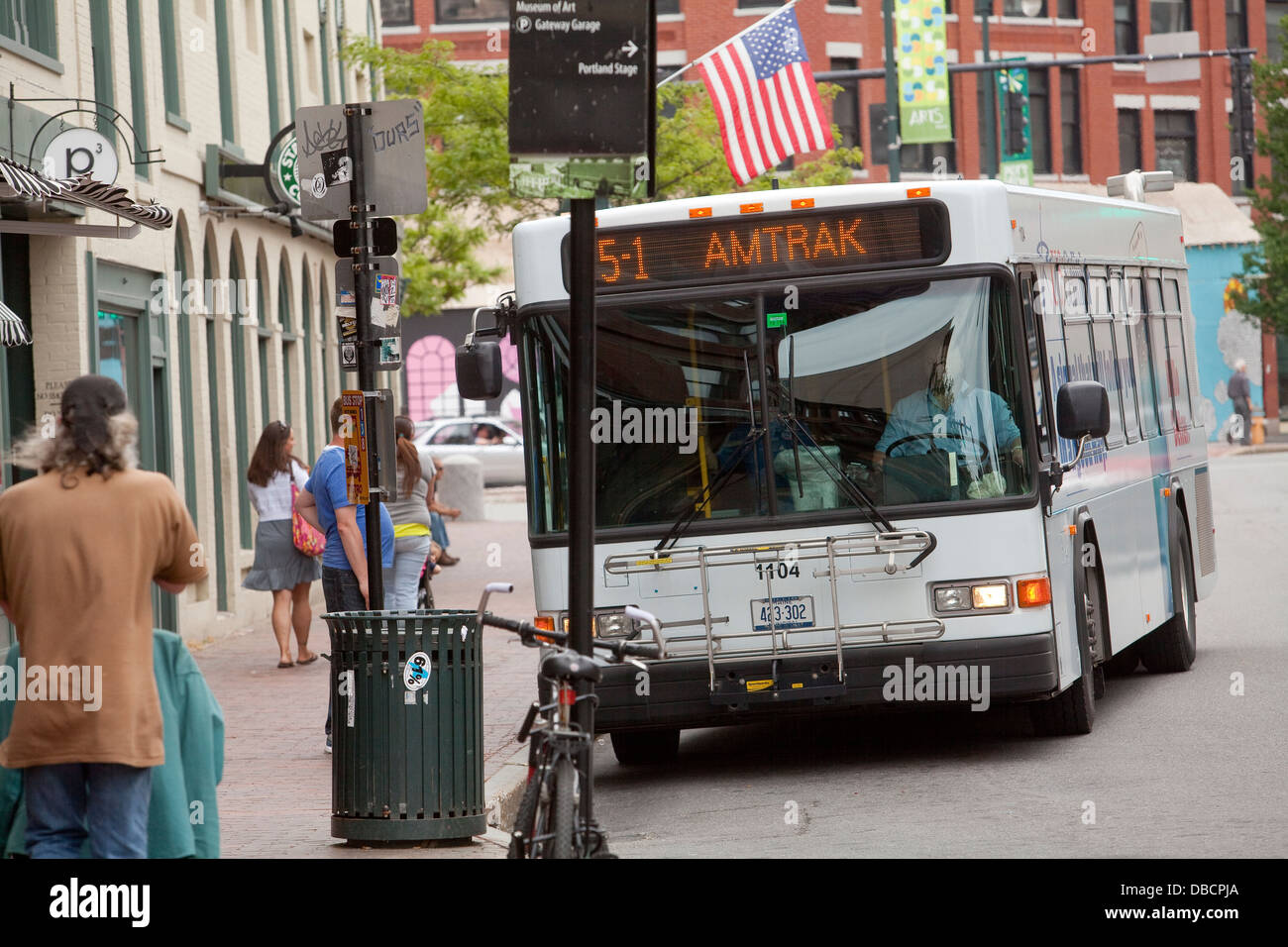 A Greater Portland Metro bus stops at a station on Congress street in