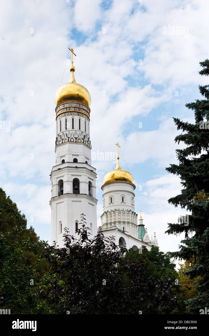 view of Ivan the Great Bell Tower and green tree in Moscow Kremlin ...