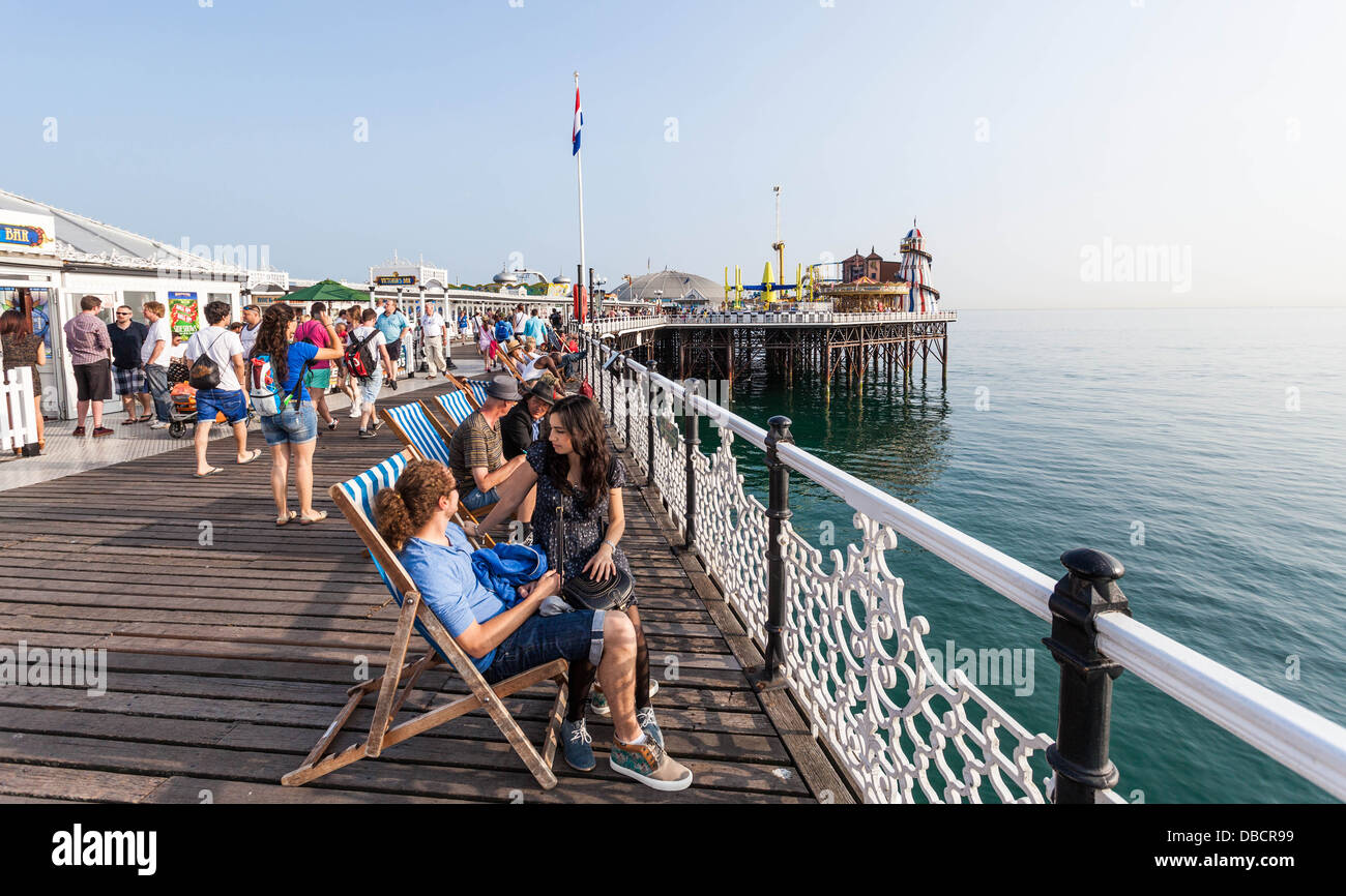 Visitors enjoying a day on Brighton Pier, England, UK. Stock Photo