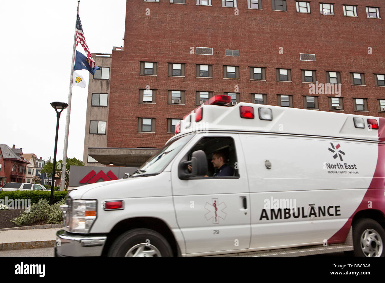 A North East Mobile Health Services ambulance drives by the Maine