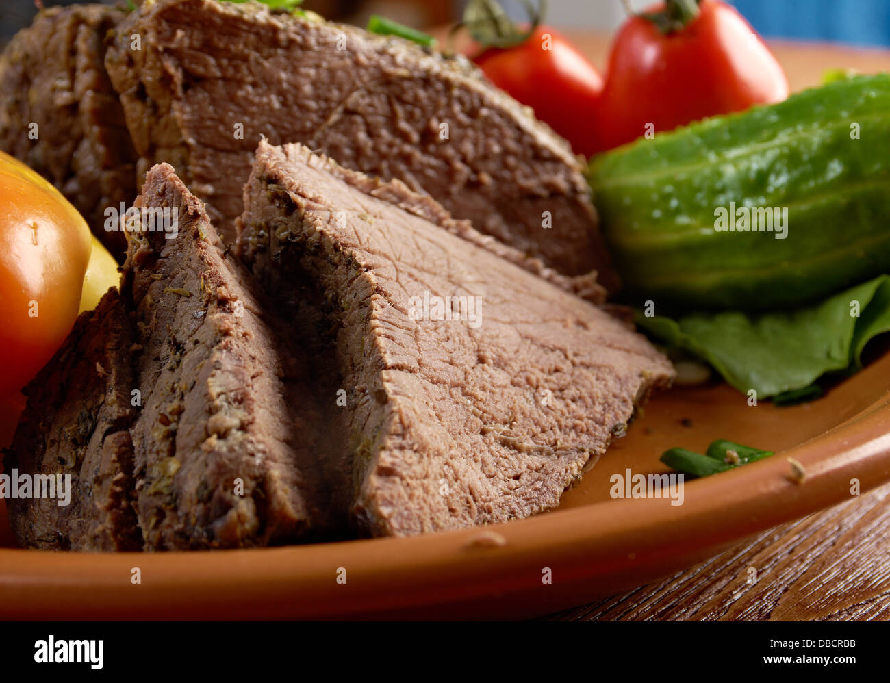 sliced rare roast beef farm-style.farmhouse kitchen Stock Photo