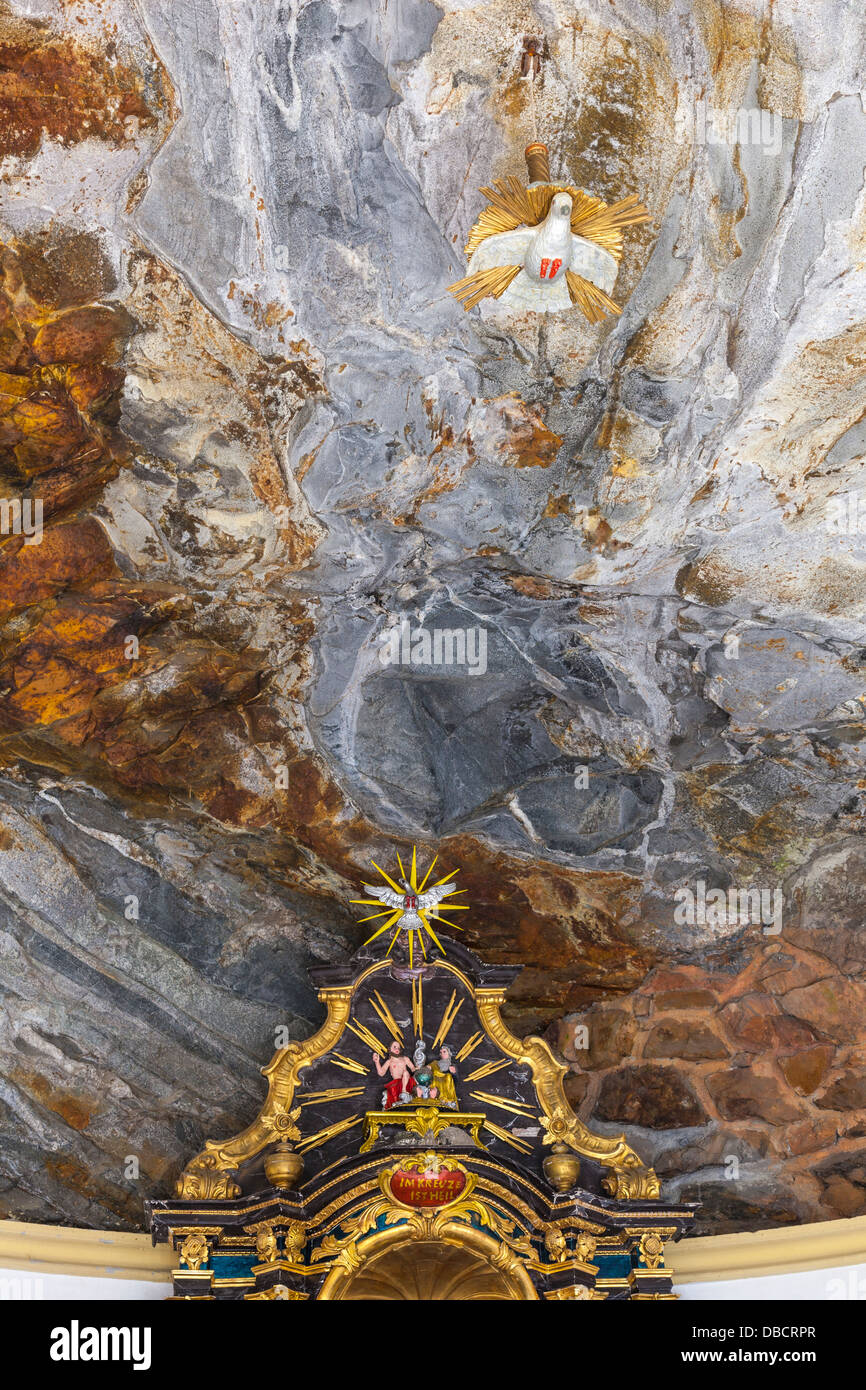White Dove Hanging From The Rock Ceiling Of The Chapel Stock Photo