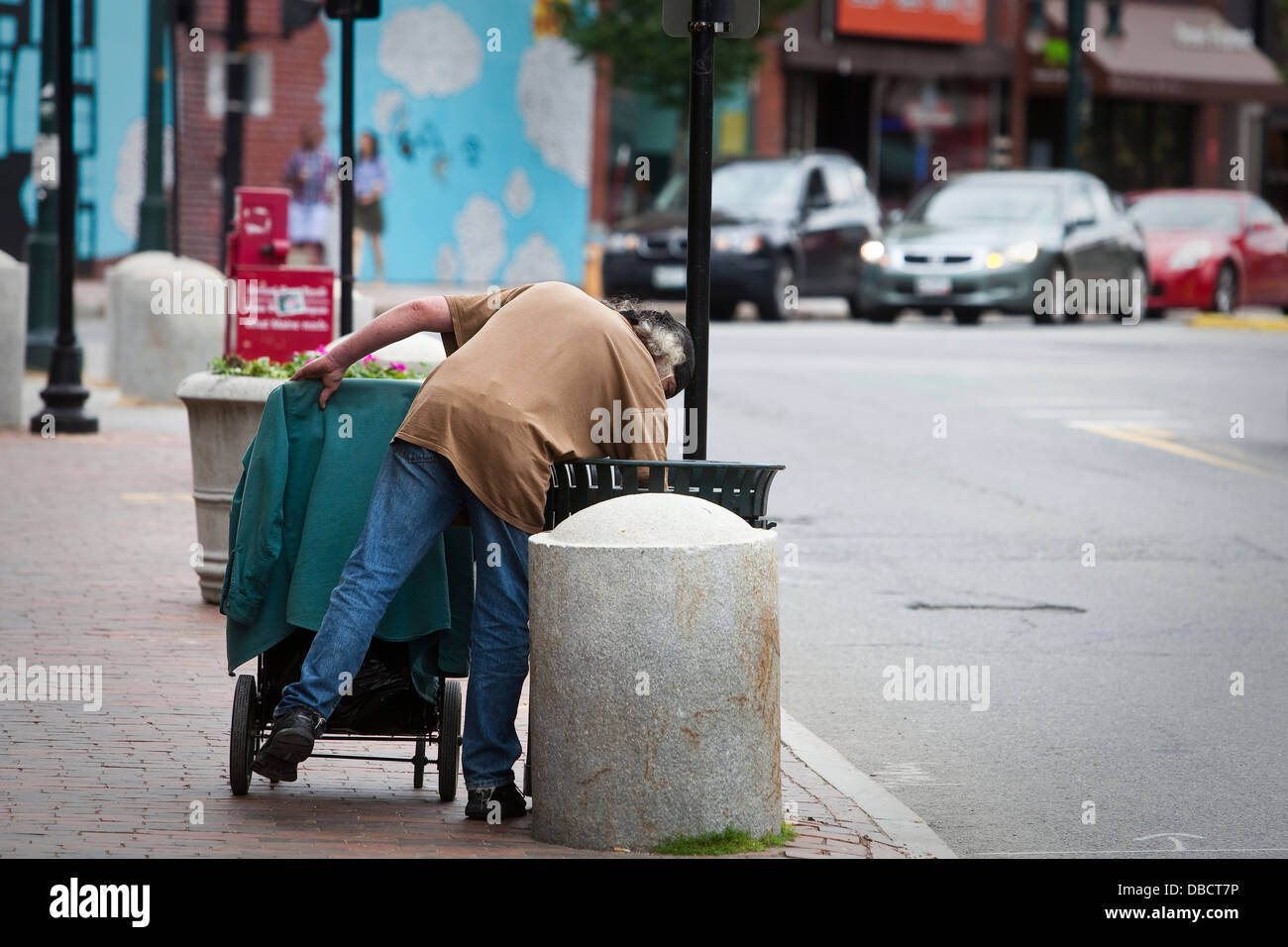 https://c8.alamy.com/comp/DBCT7P/a-man-searches-into-garbage-can-on-congress-street-in-portland-maine-DBCT7P.jpg