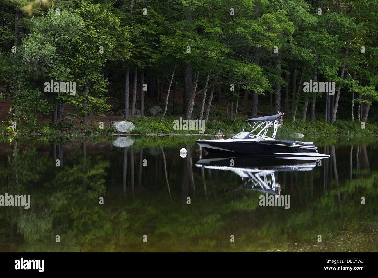 A motor boat is moored on Sebago Lake in South Casco, Maine Stock Photo