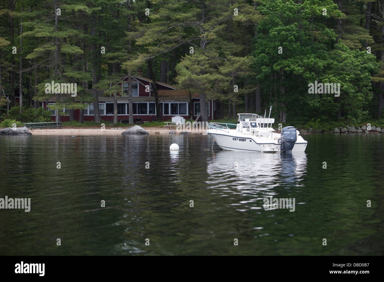 A motor boat is anchored on Sebago Lake in South Casco, Maine Stock